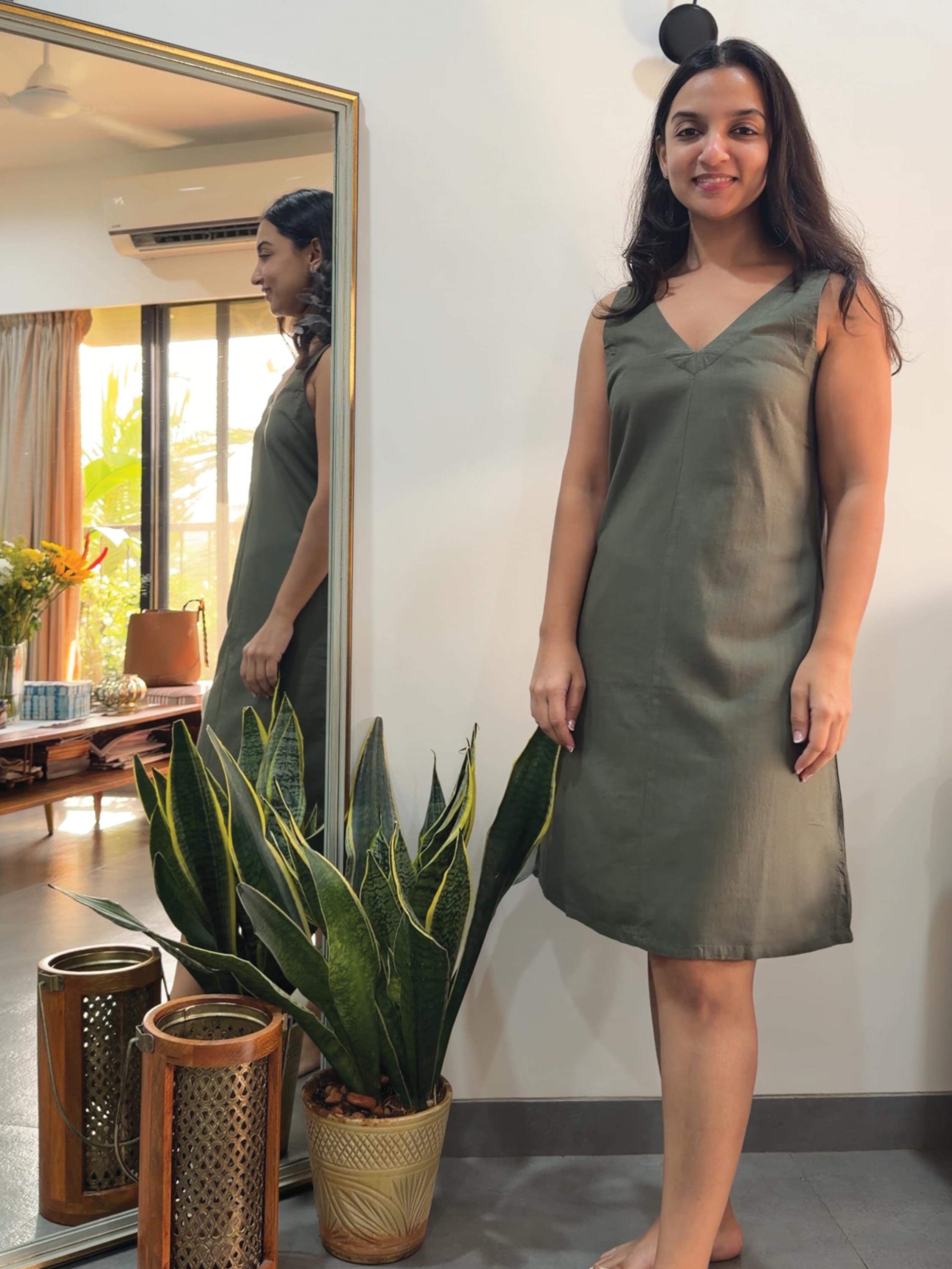 Woman wearing  Rerasa's green dress
