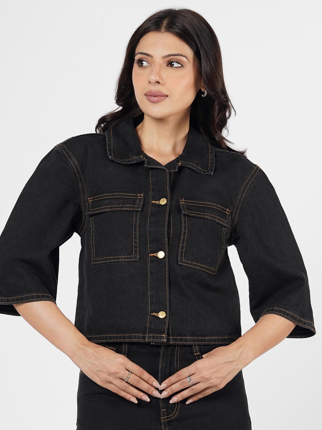 Woman wearing a dark denim Shacket by Rerasa