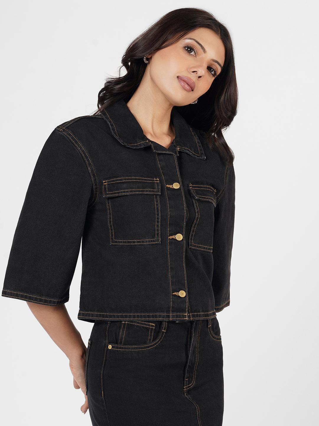Woman wearing a dark denim Shacket by Rerasa