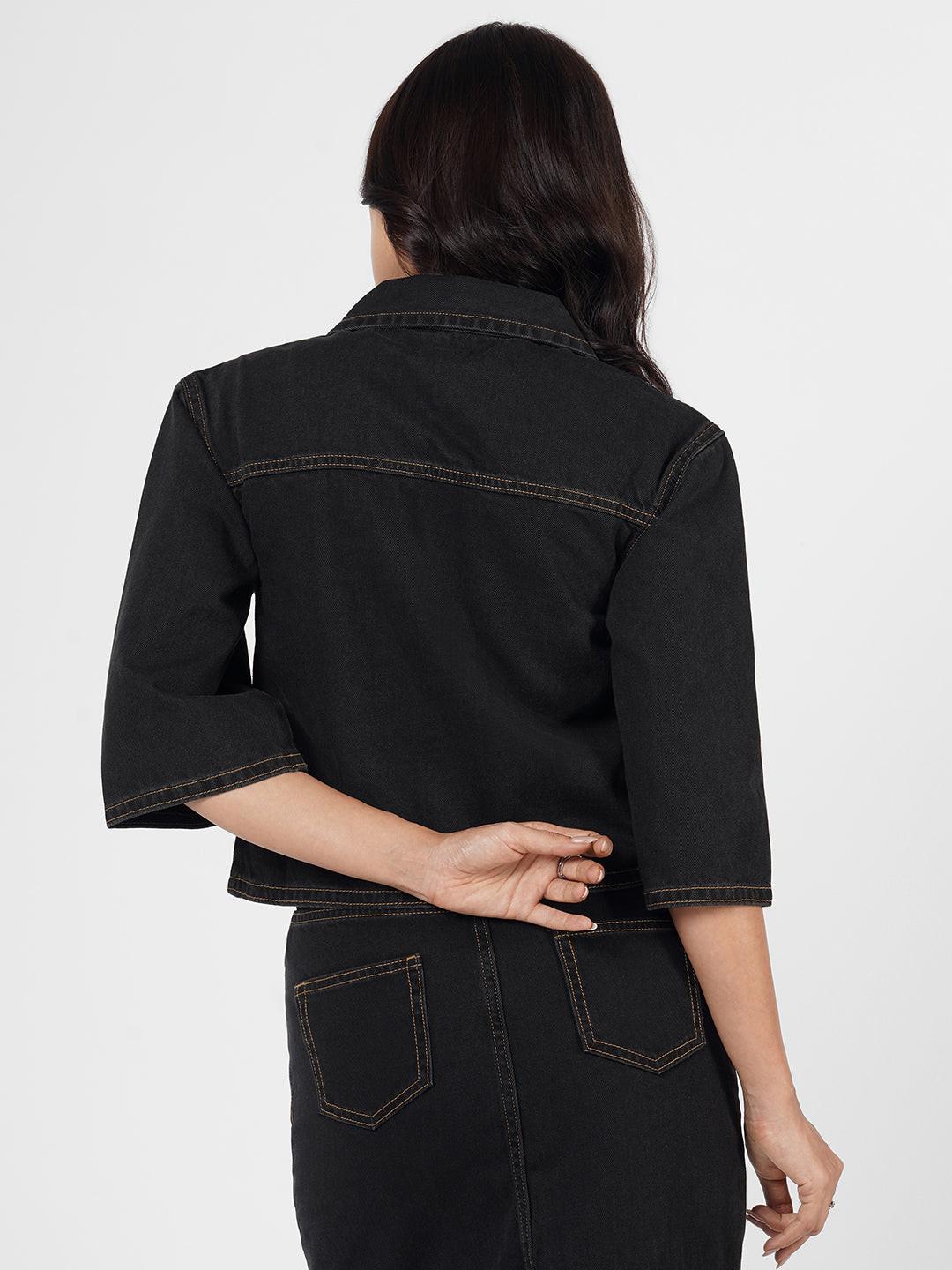 Woman wearing a dark denim Shacket by Rerasa