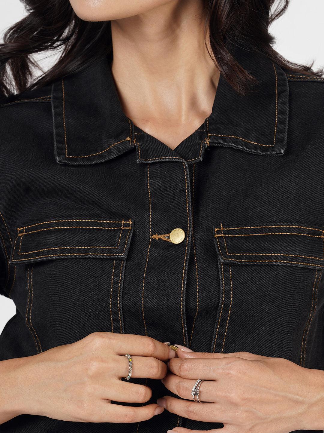 Woman wearing a dark denim Shacket by Rerasa
