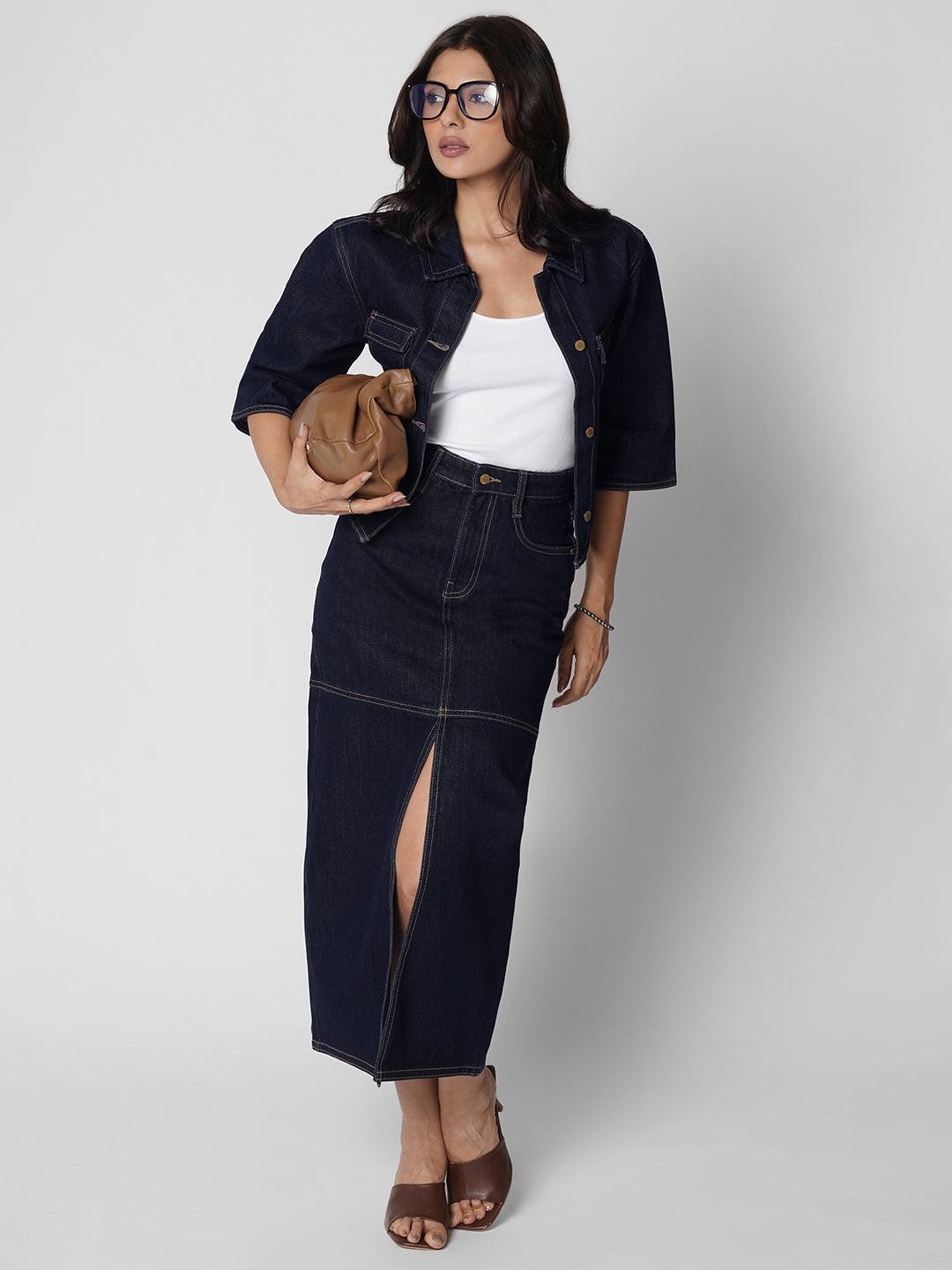 Woman wearing a dark denim Shacket by Rerasa