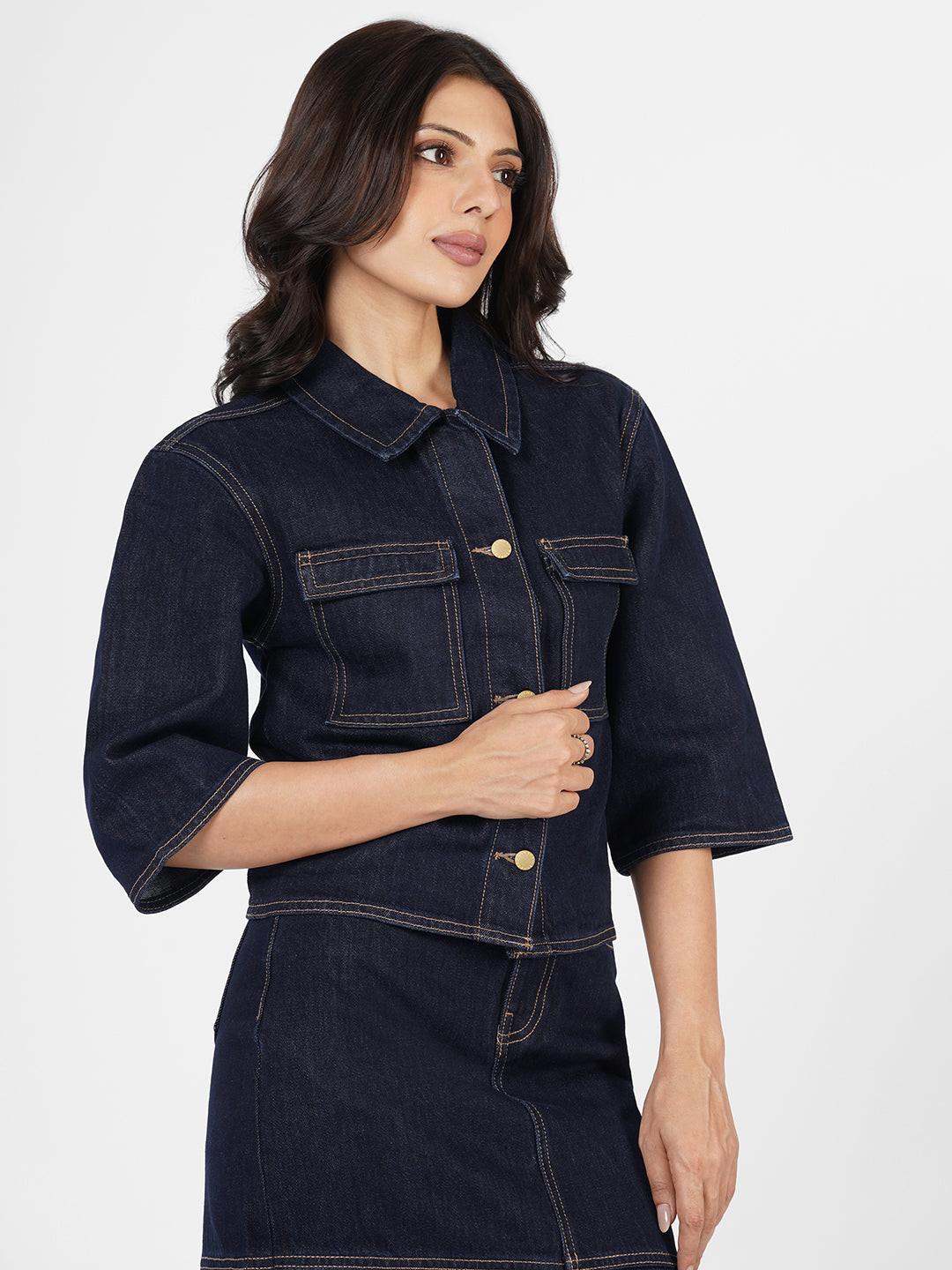 Woman wearing a dark denim Shacket by Rerasa