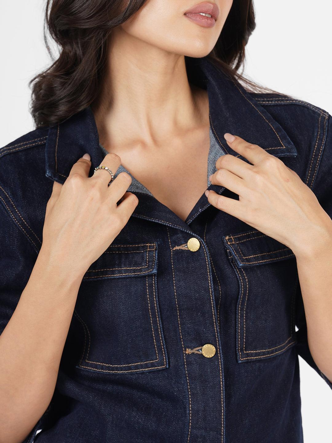 Woman wearing a dark denim Shacket by Rerasa