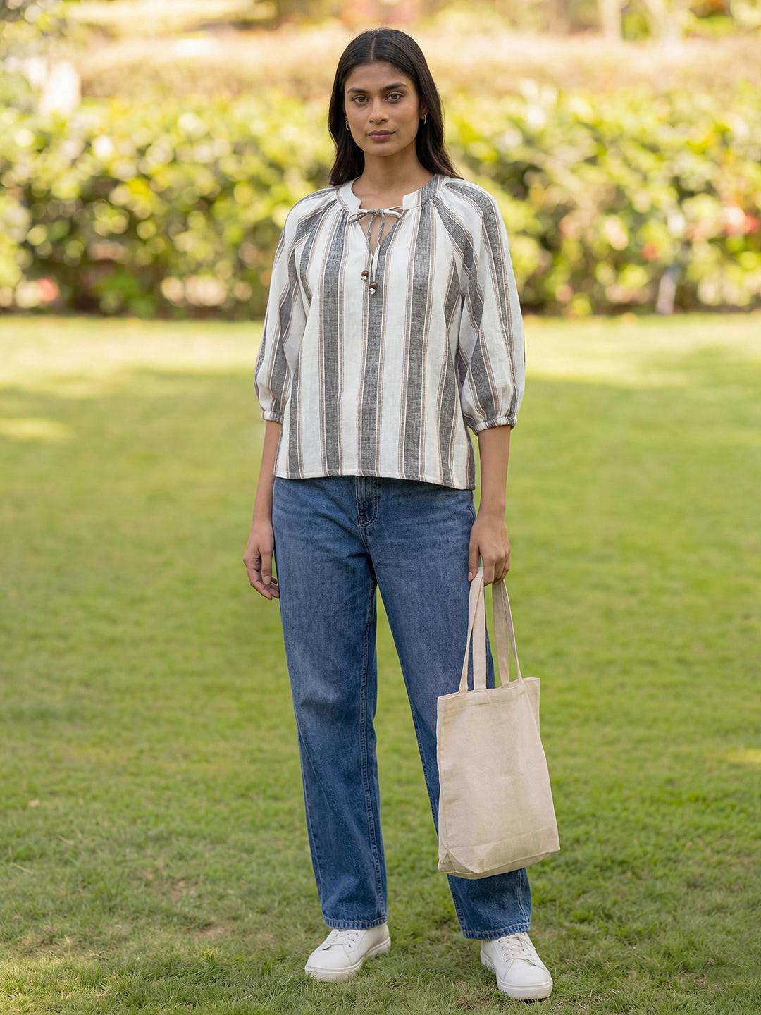 Woman standing , wearing a striped top by Rerasa