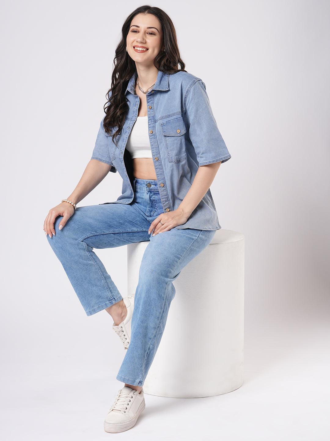 Woman wearing a light blue denim shirt by Rerasa