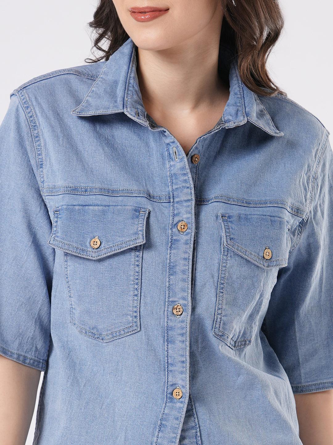 Woman wearing a light blue denim shirt by Rerasa