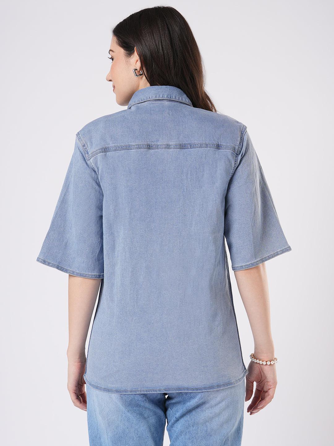 Woman wearing a light blue denim shirt by Rerasa