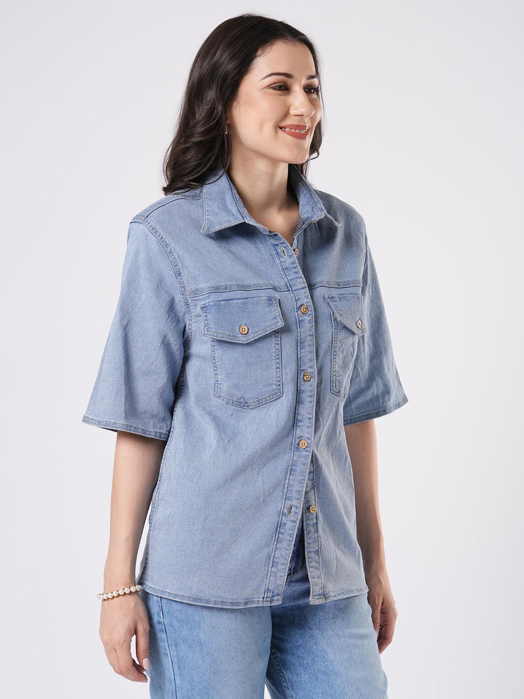 Woman wearing a light blue denim shirt by Rerasa
