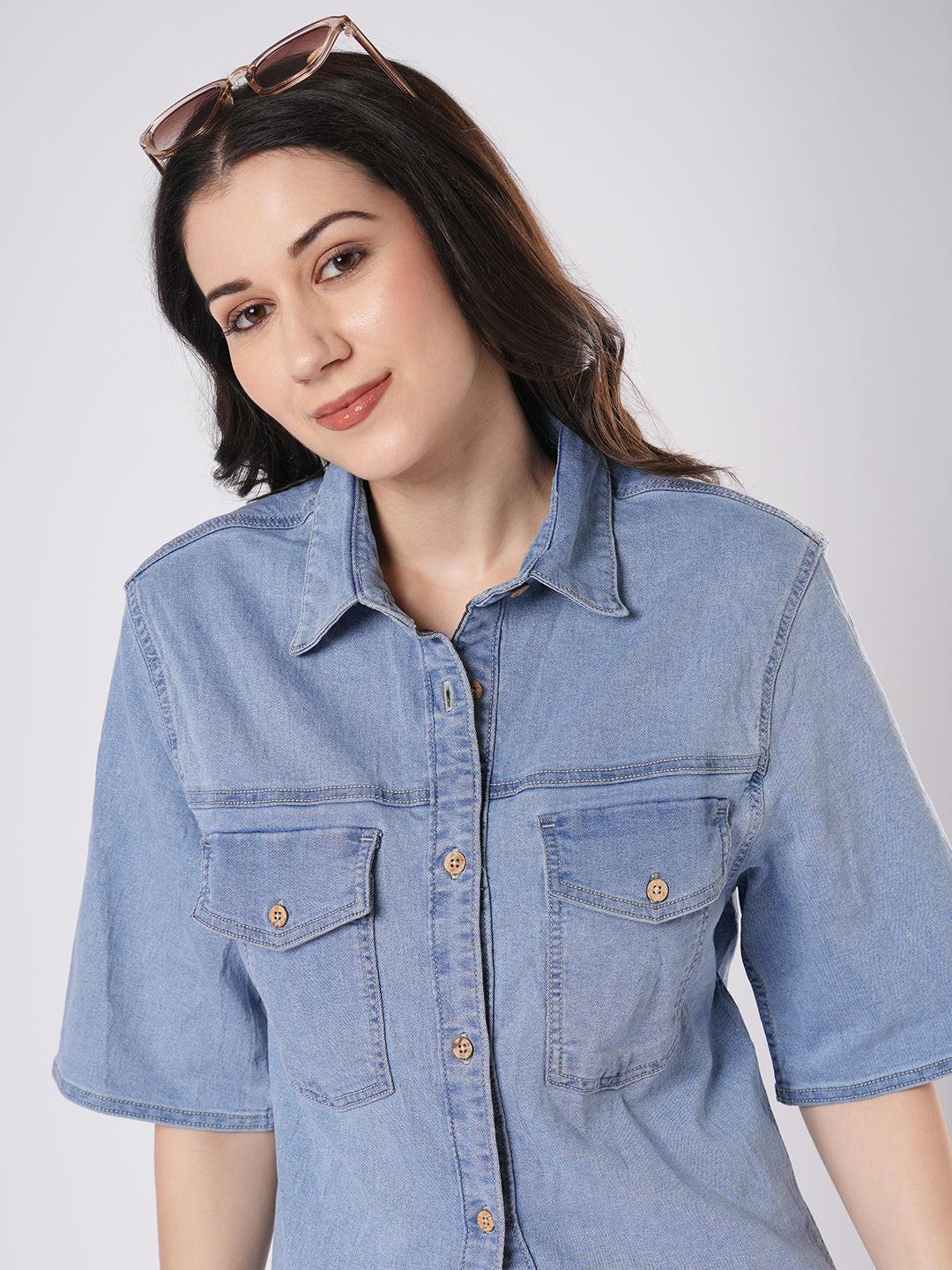 Woman wearing a light blue denim shirt by Rerasa