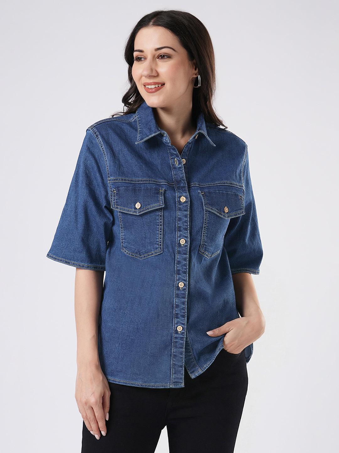 Woman wearing a mid blue denim shirt by Rerasa