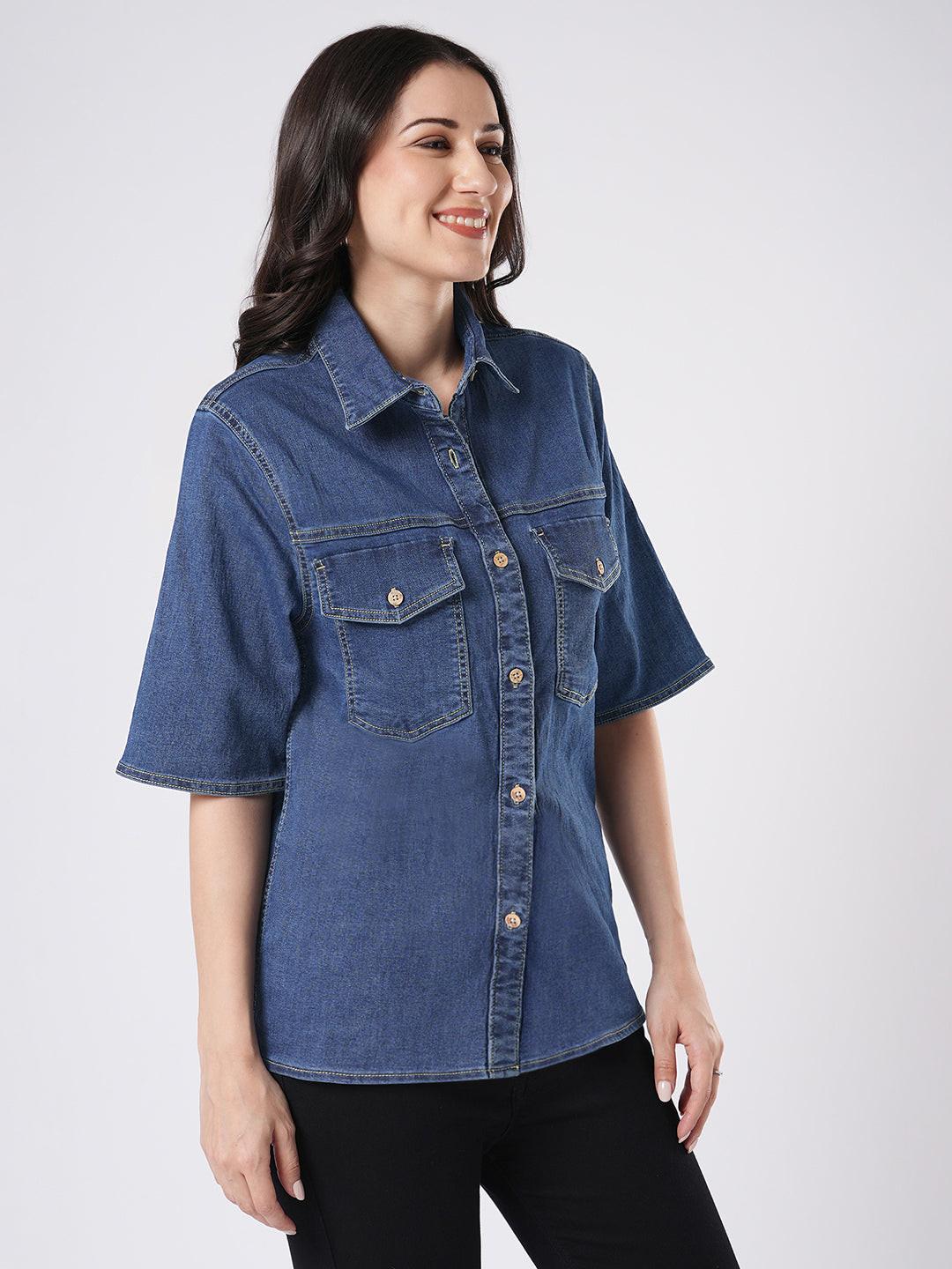 Woman wearing a mid blue denim shirt by Rerasa
