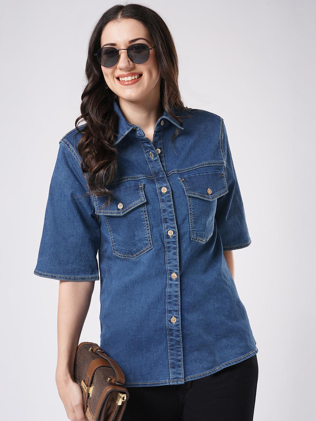 Woman wearing a mid blue denim shirt by Rerasa