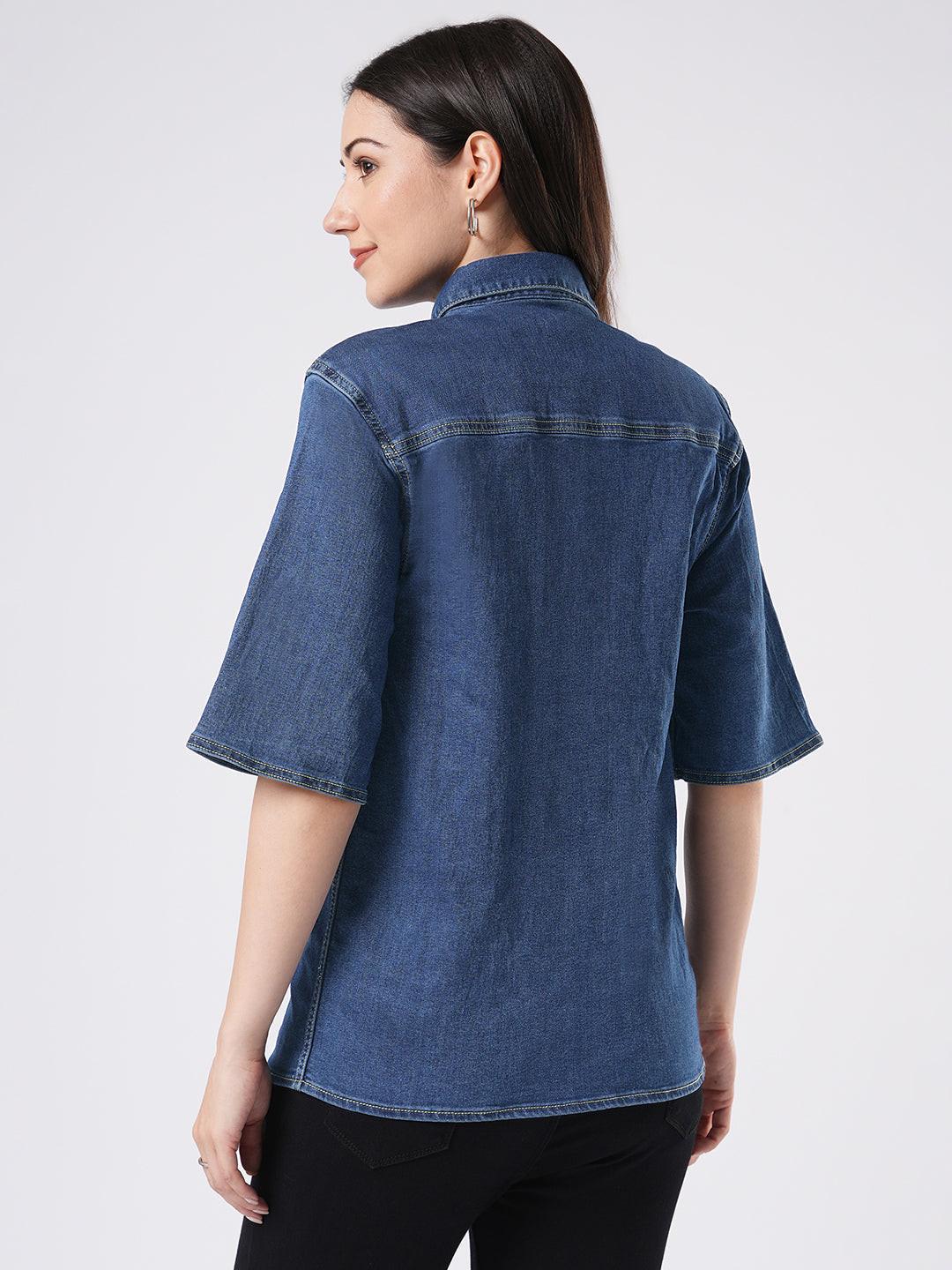 Woman wearing a mid blue denim shirt by Rerasa