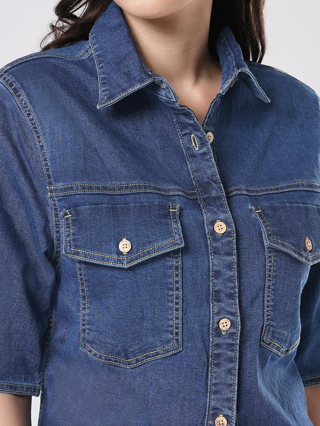 Woman wearing a mid blue denim shirt by Rerasa
