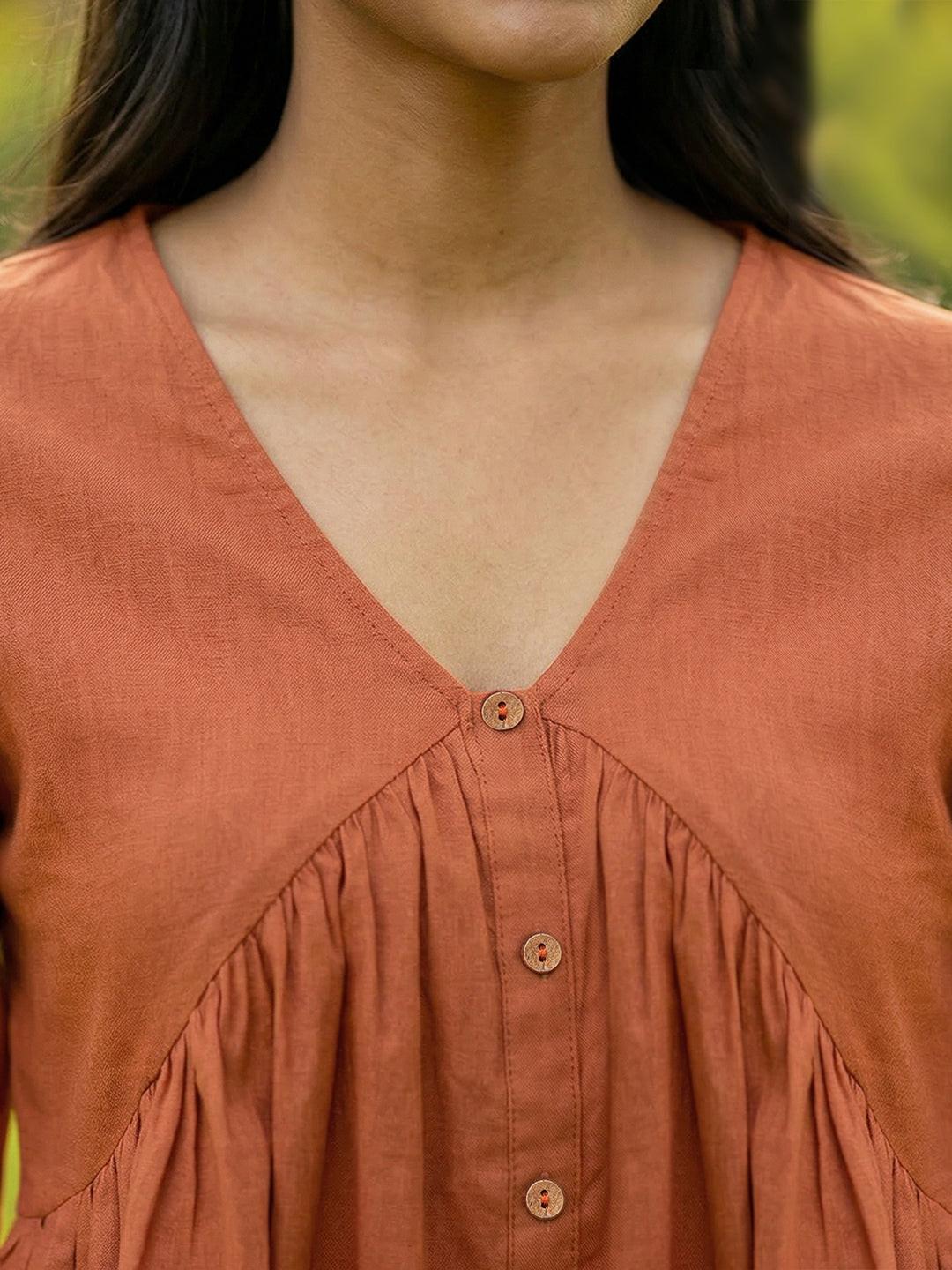 Woman wearing a Orange blouse with ruffled sleeves by Rerasa