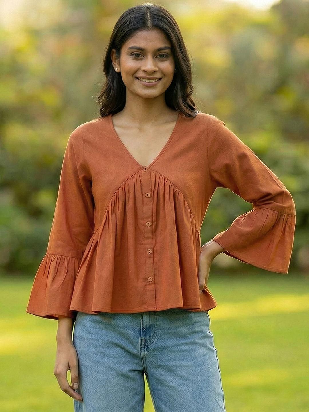 Woman wearing a Orange blouse with ruffled sleeves by Rerasa