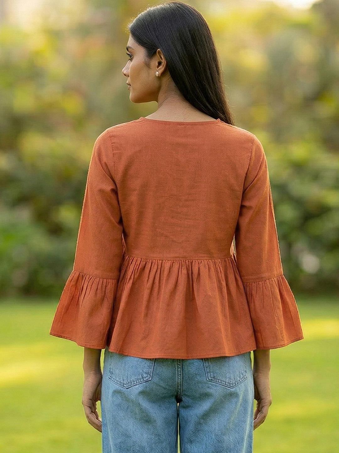 Woman wearing a Orange blouse with ruffled sleeves by Rerasa