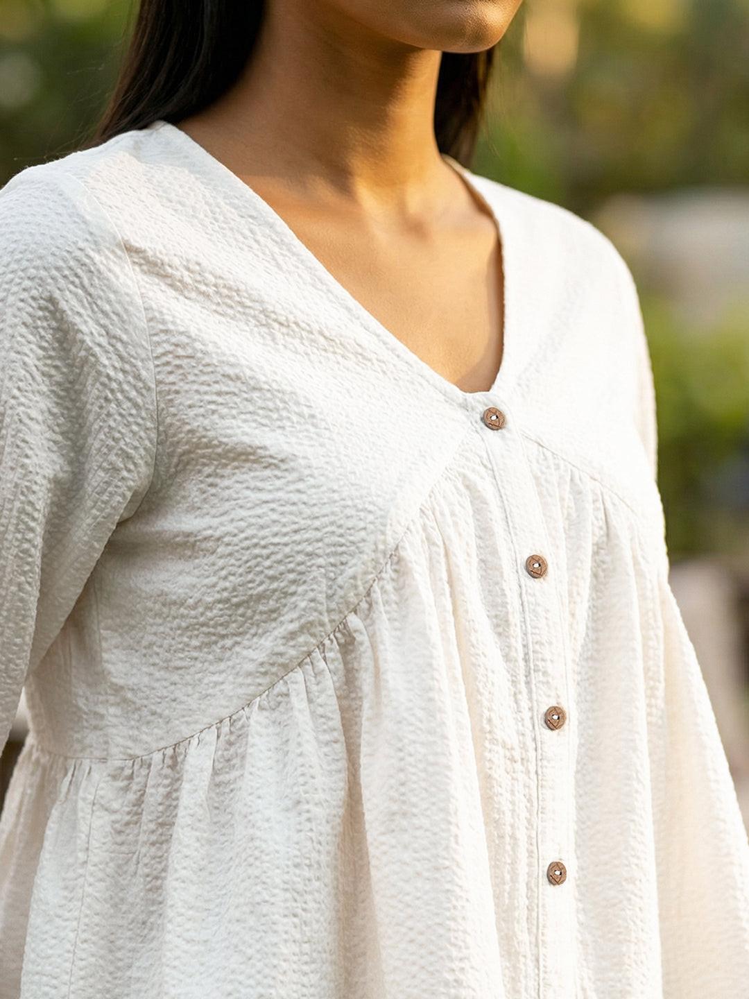 Woman wearing a White blouse with ruffled sleeves by Rerasa
