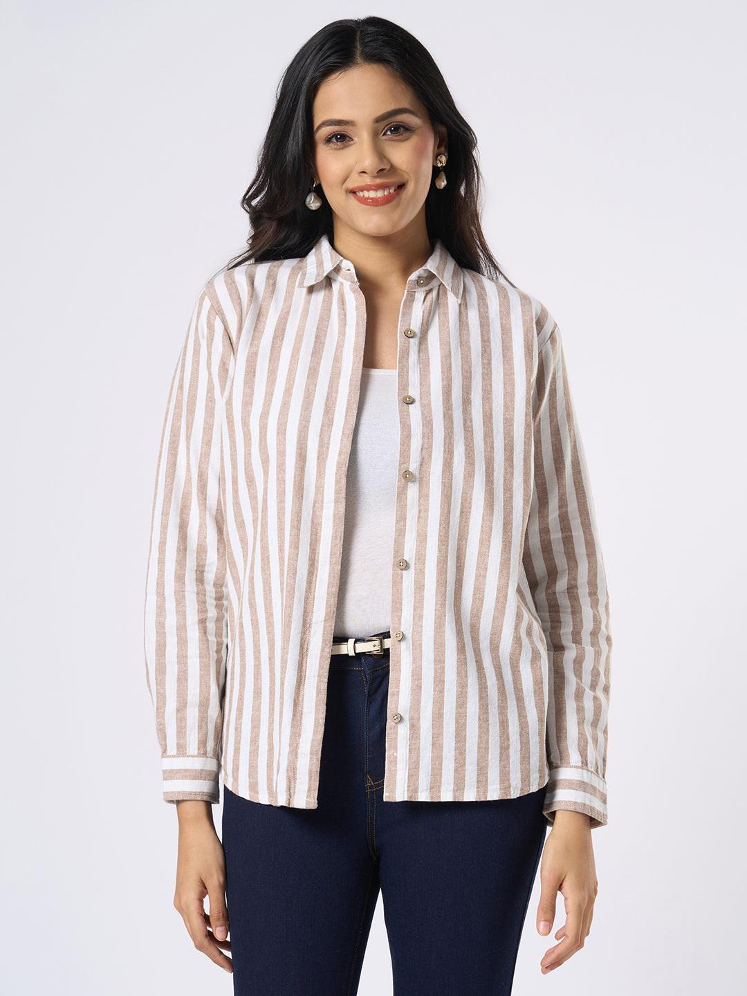 Woman wearing a Rerasa beige and white striped shirt on a white background