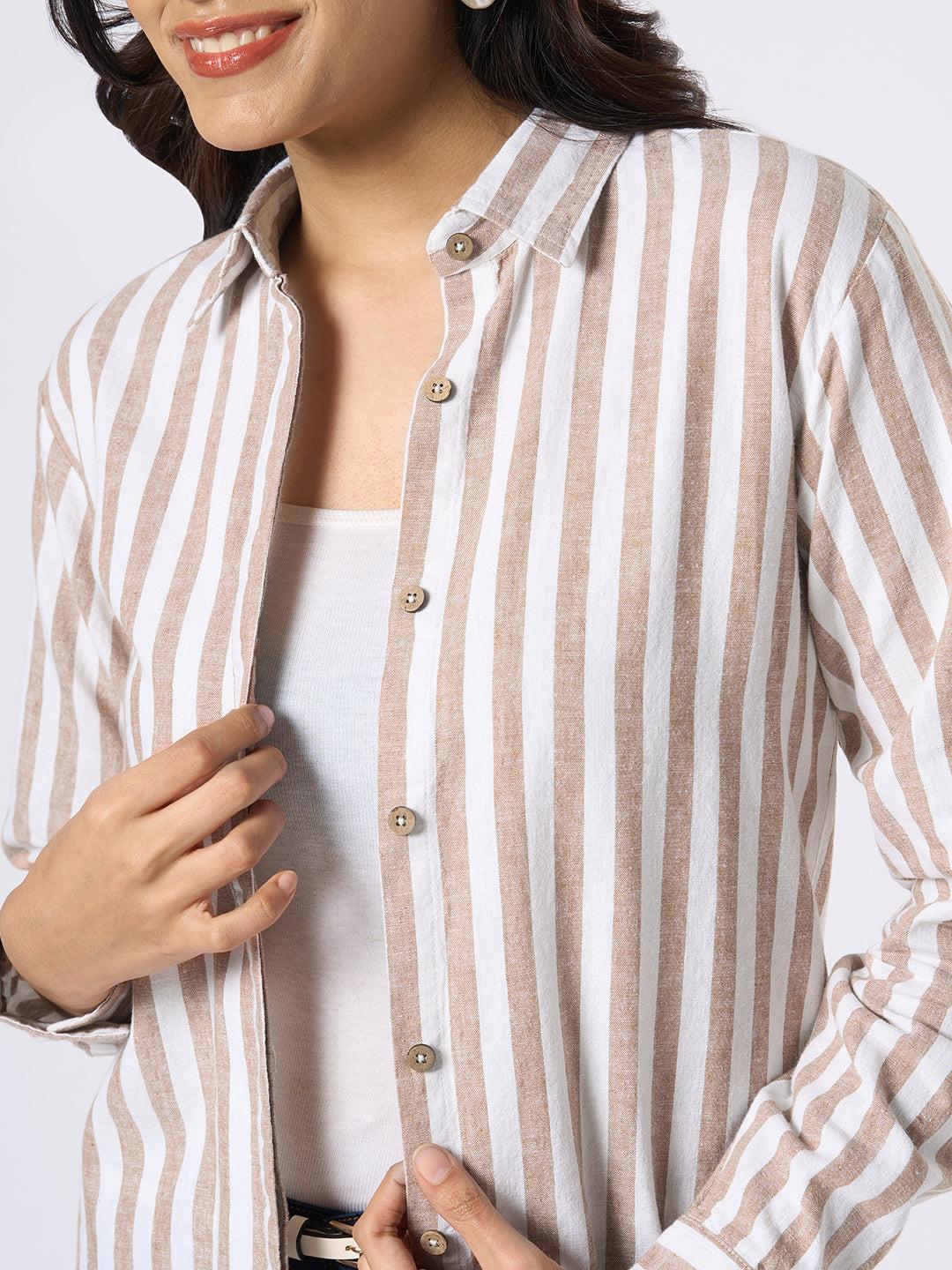 Close-up of a person wearing a Rerasa beige and white striped shirt against a white background