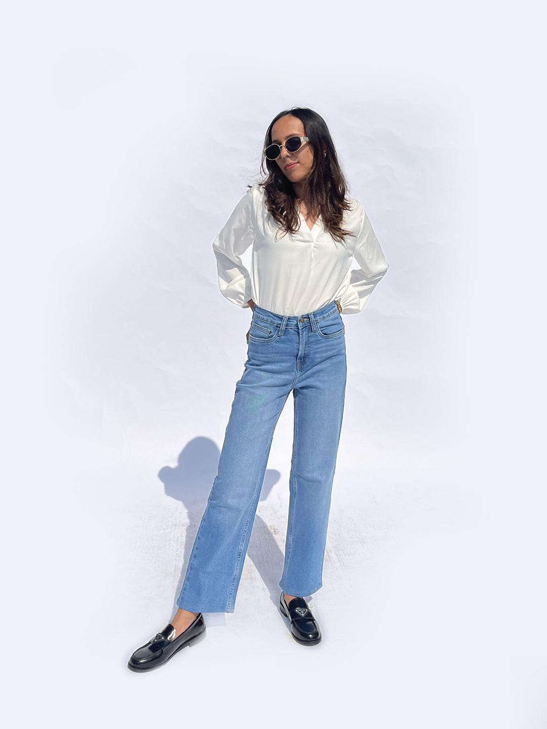 Person wearing straight blue jeans by Rerasa