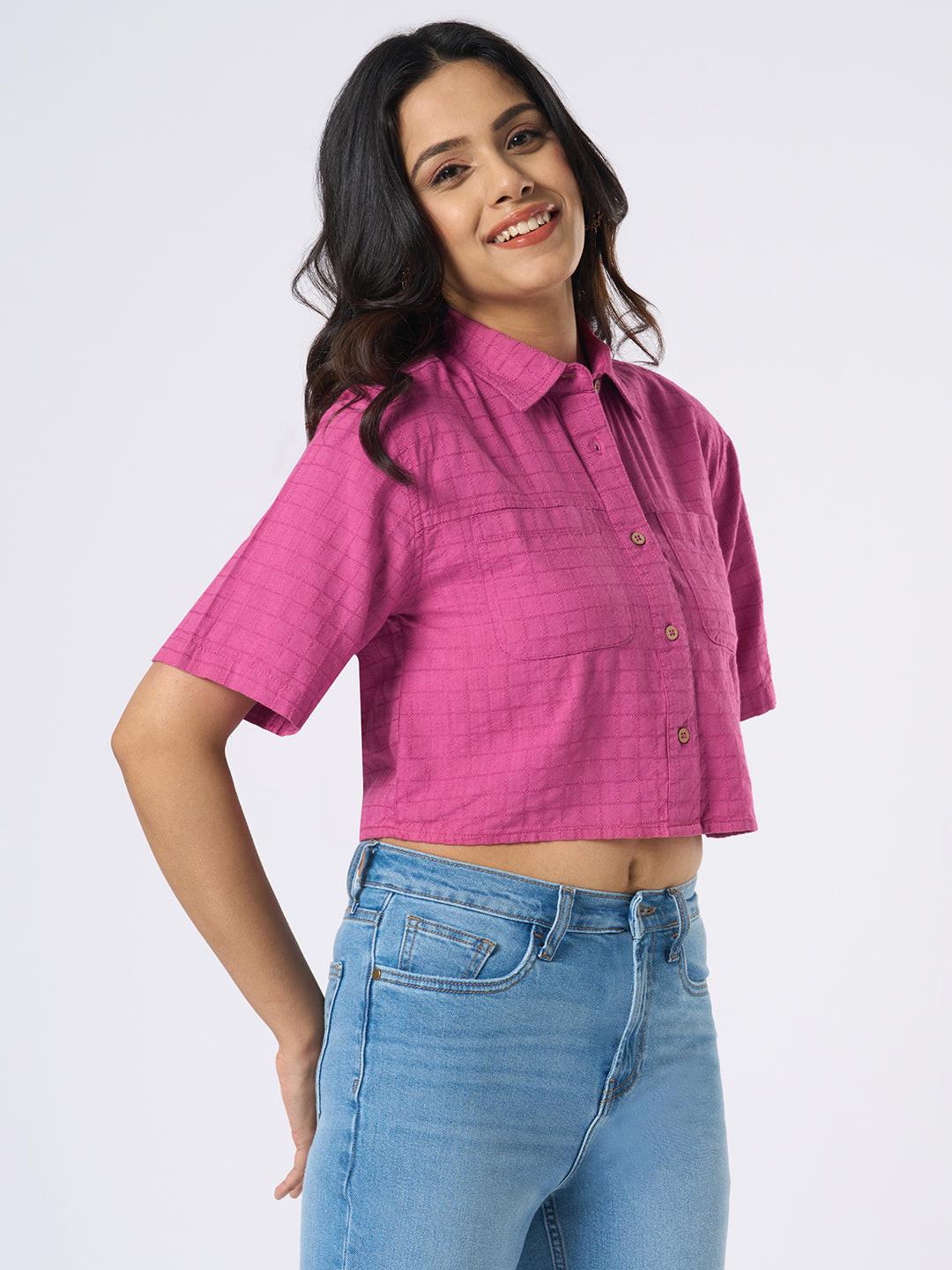 Woman wearing a pink checkered crop top by Rerasa