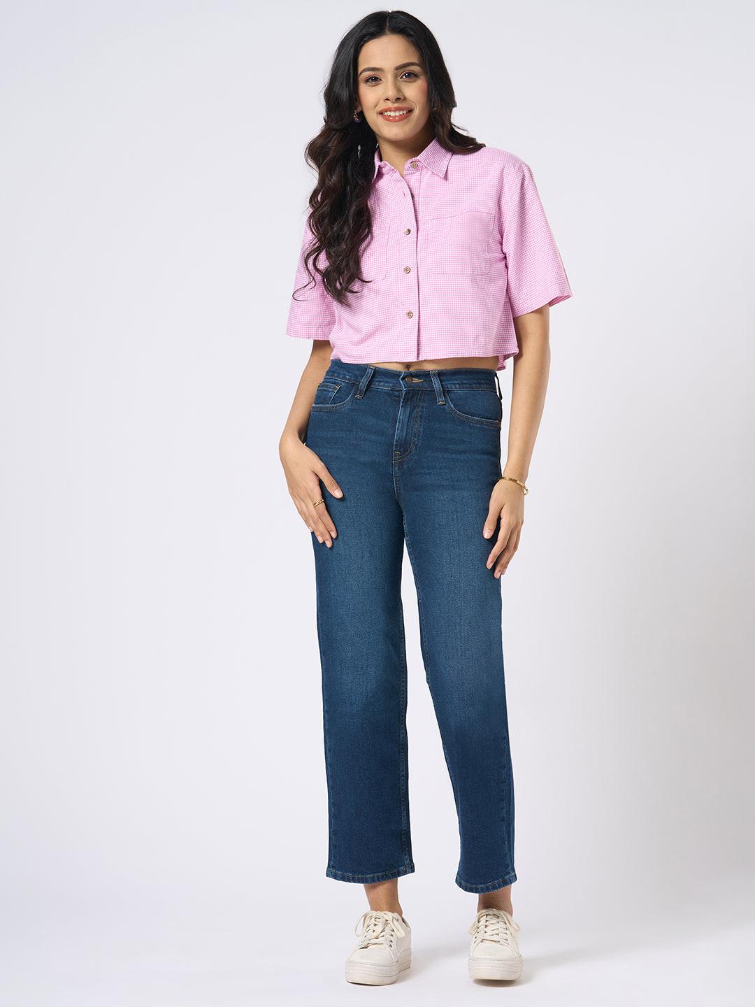 Woman wearing a gingham checkered crop top by Rerasa
