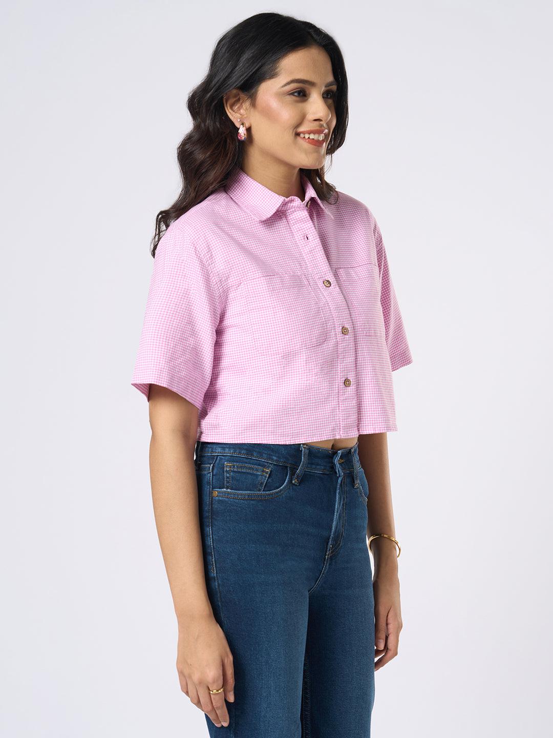 Woman wearing a gingham checkered crop top by Rerasa