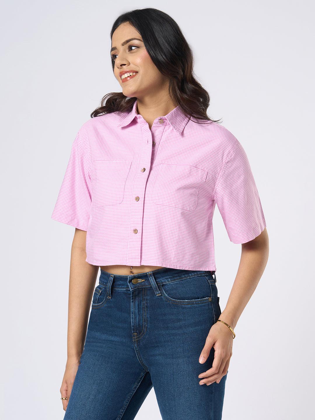 Woman wearing a gingham checkered crop top by Rerasa