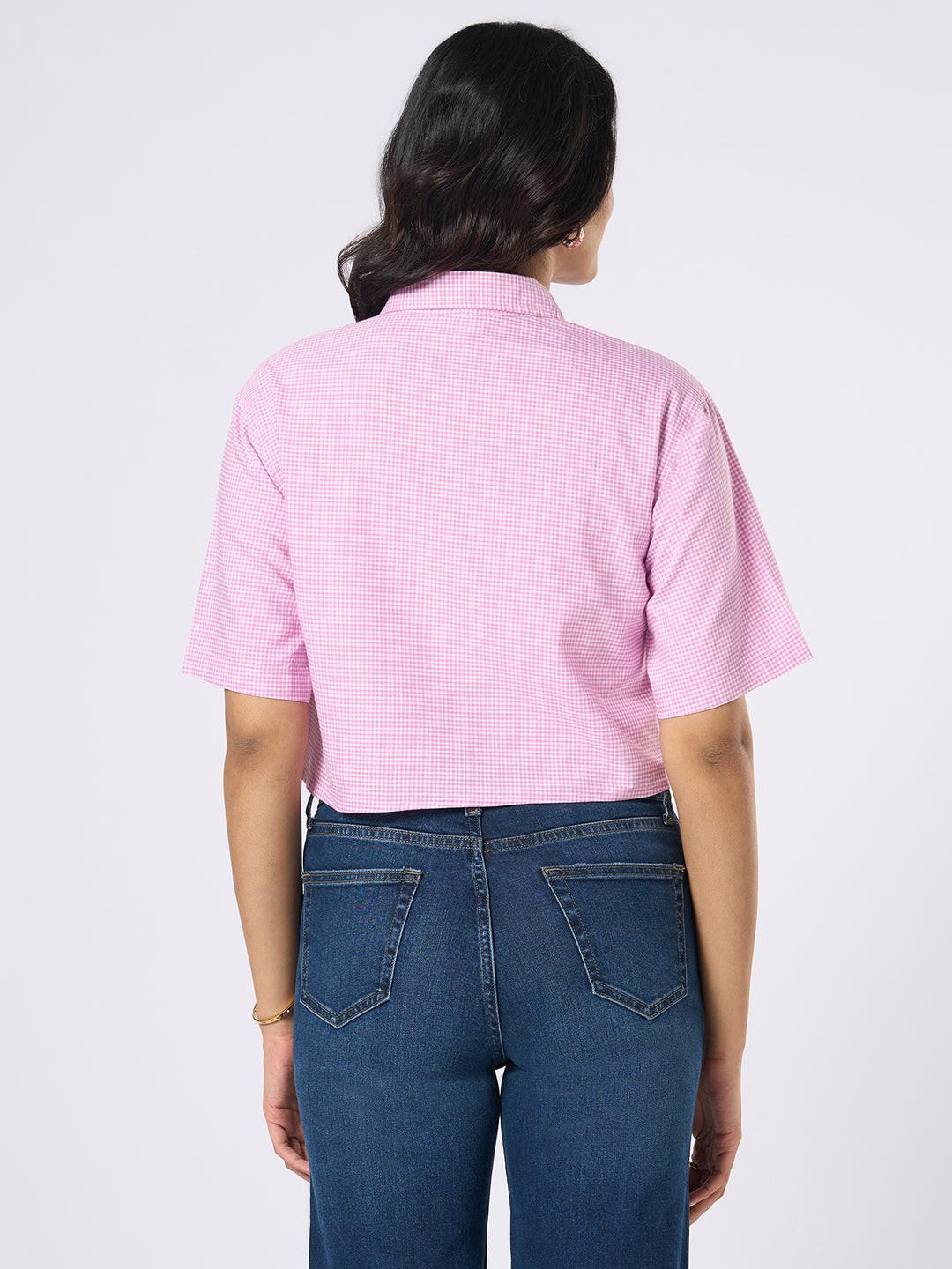 Woman wearing a gingham checkered crop top by Rerasa