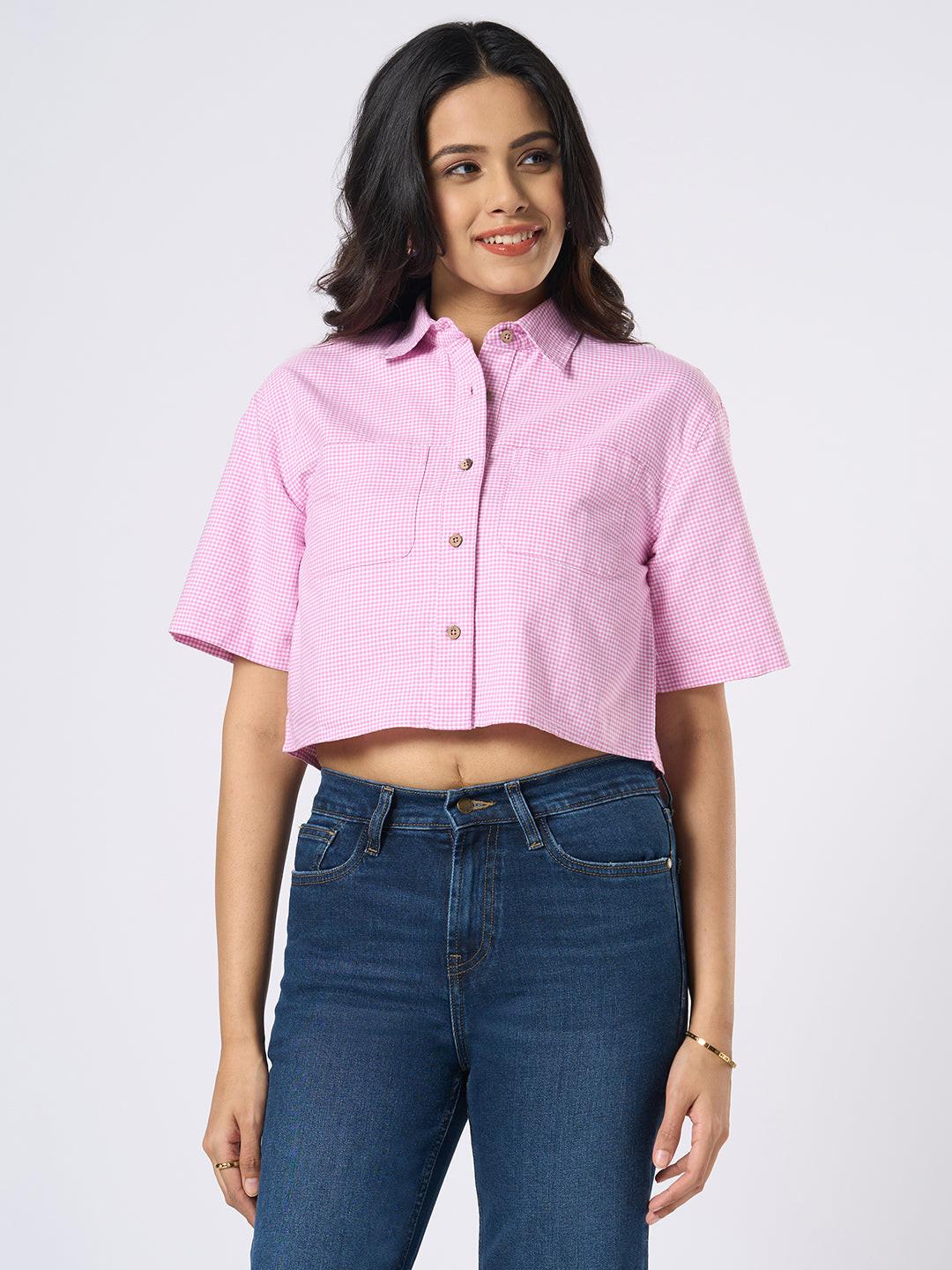 Woman wearing a gingham checkered crop top by Rerasa