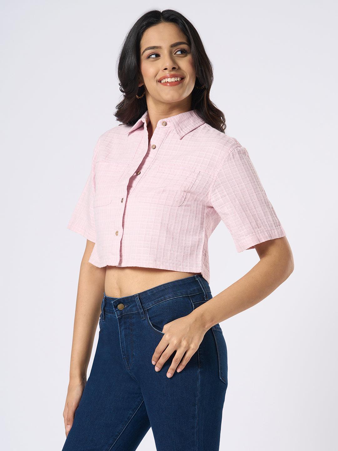 Woman wearing a pink checkered crop top by Rerasa