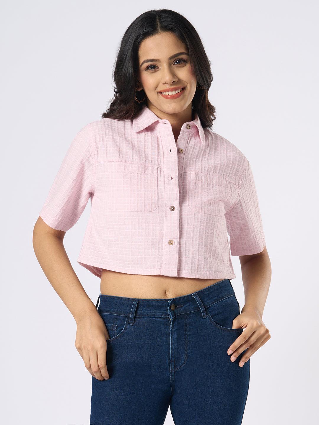 Woman wearing a pink checkered crop top by Rerasa