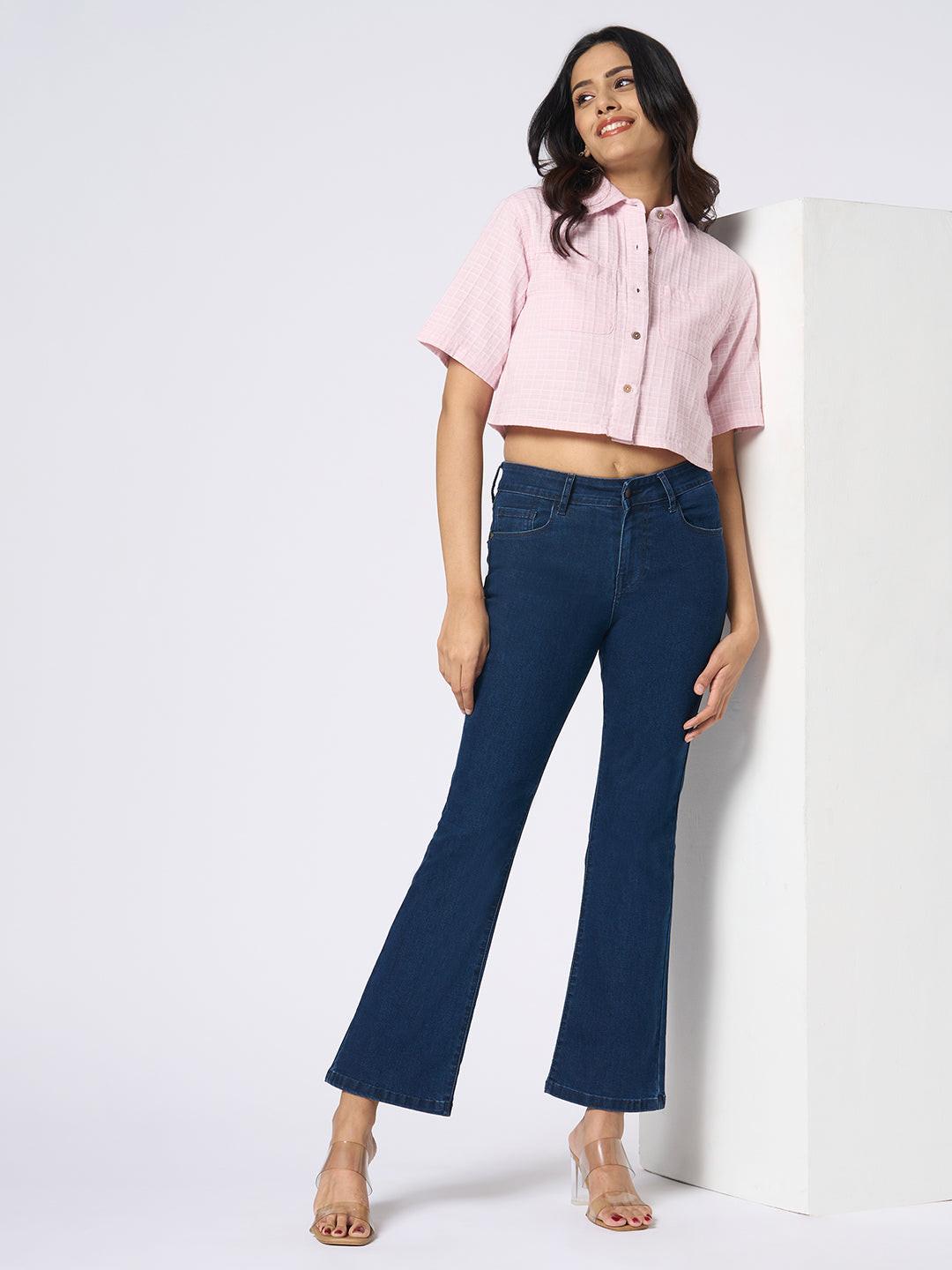 Woman wearing a pink checkered crop top by Rerasa