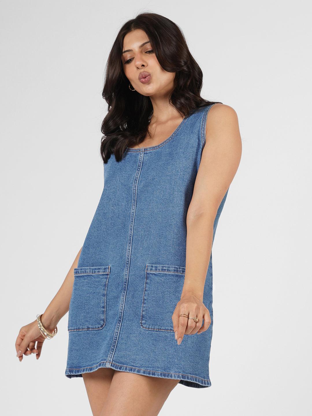 Blue denim dress worn by model