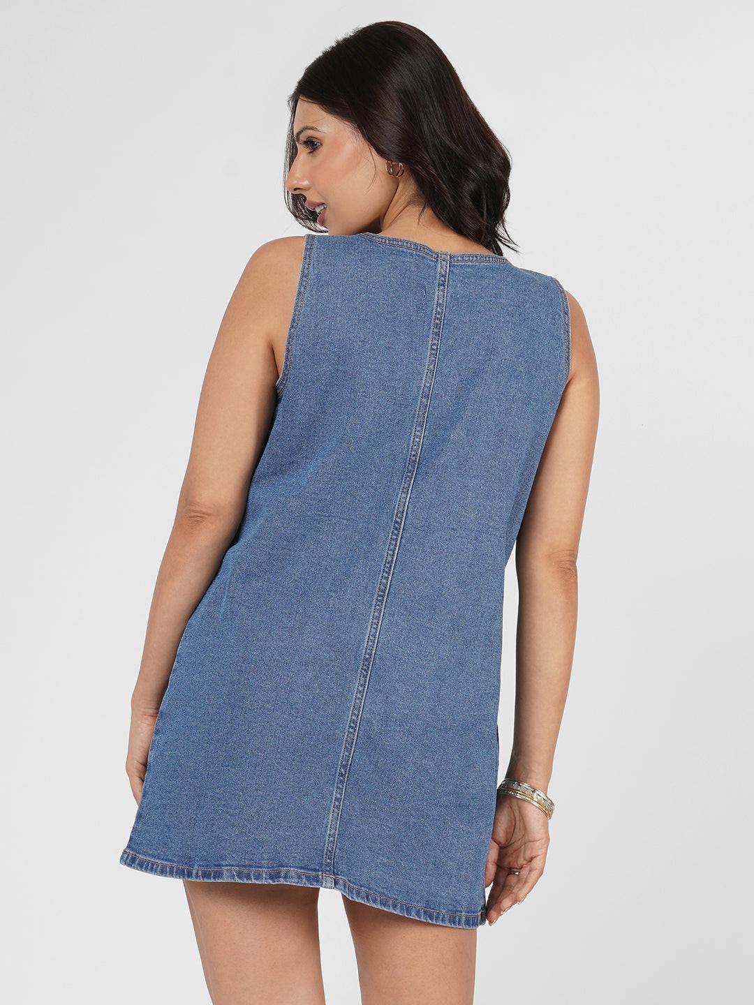 Blue denim dress worn by model