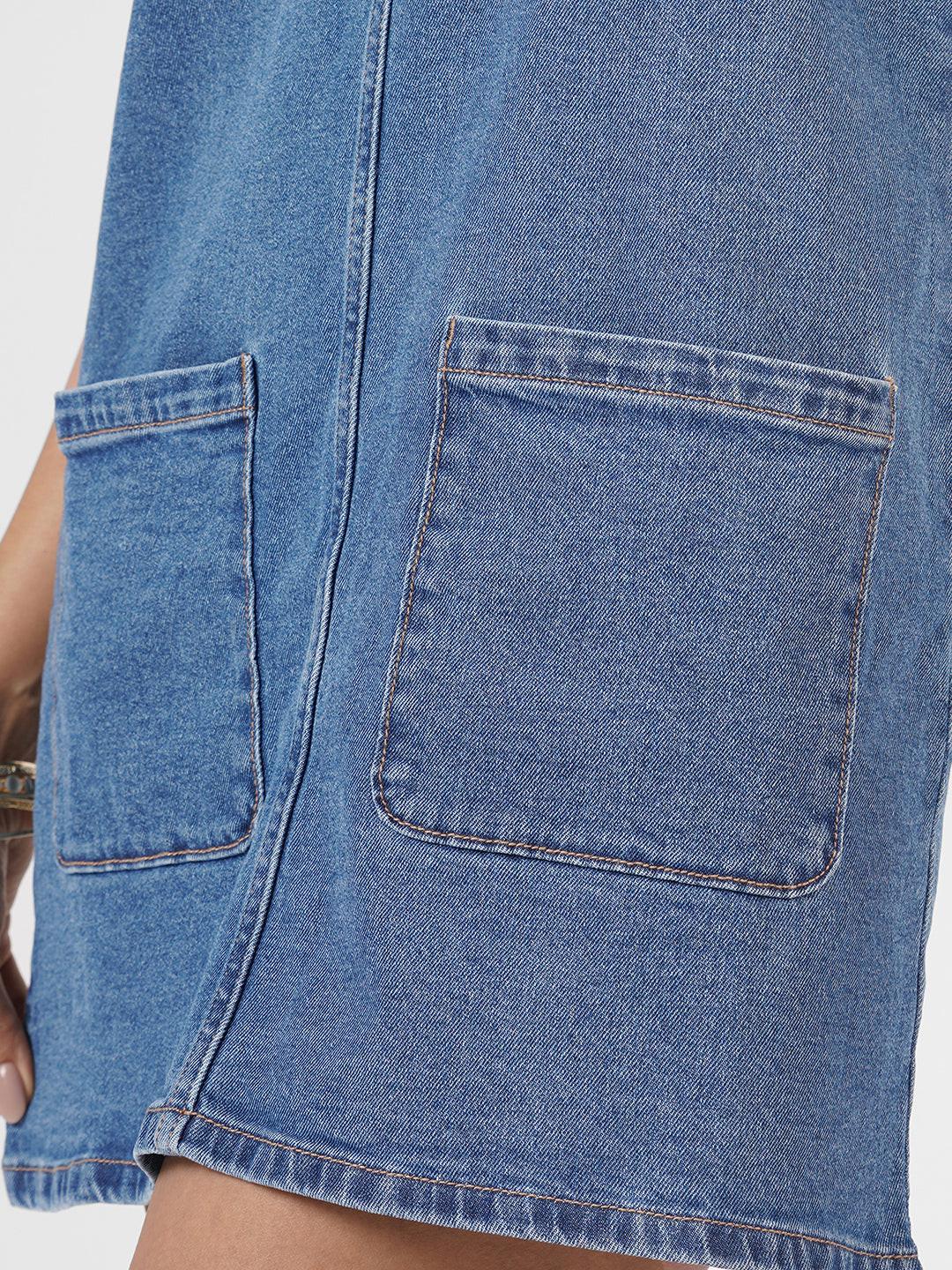Blue denim dress worn by model