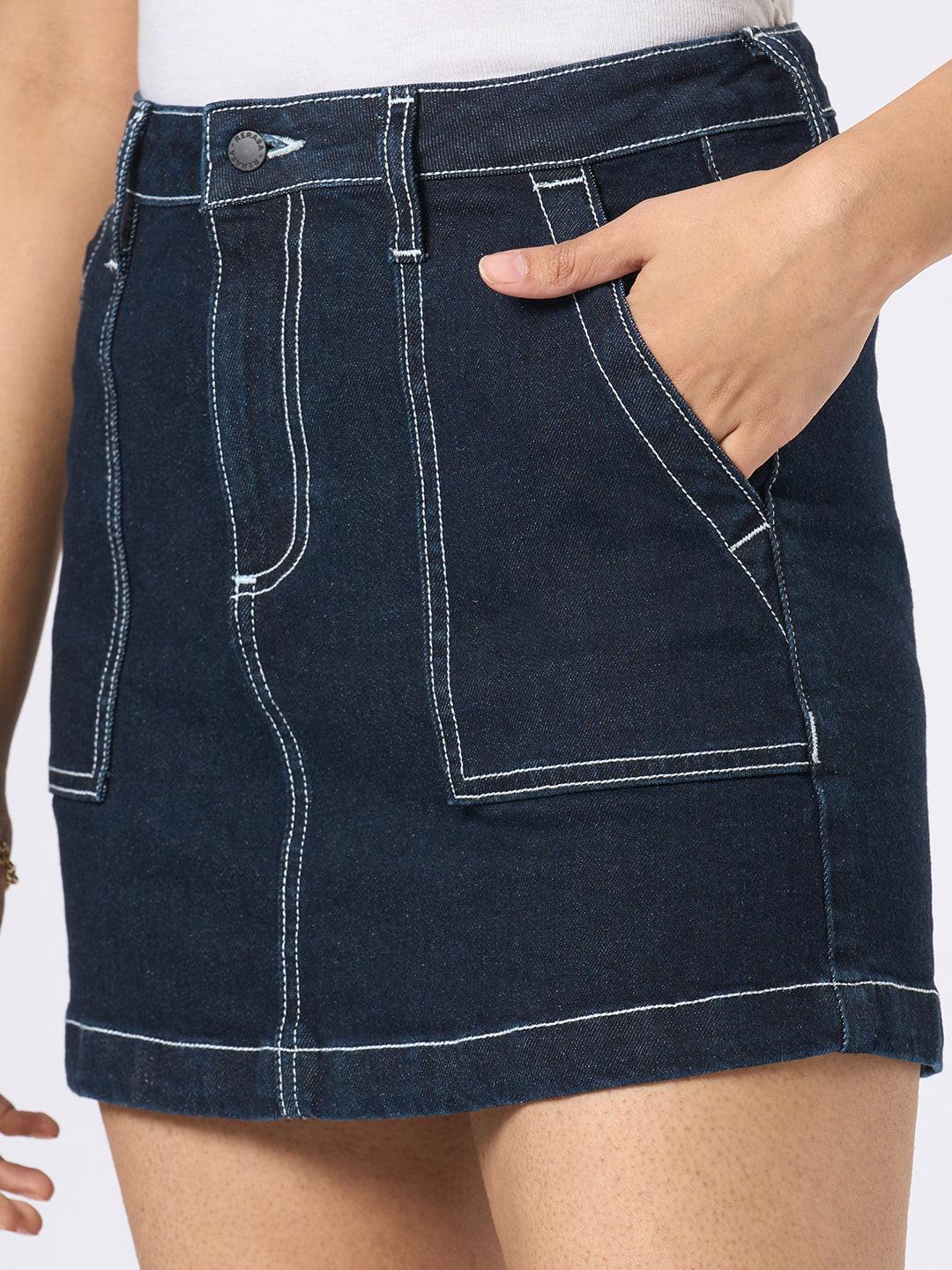 Person wearing a dark denim skirt by Rerasa