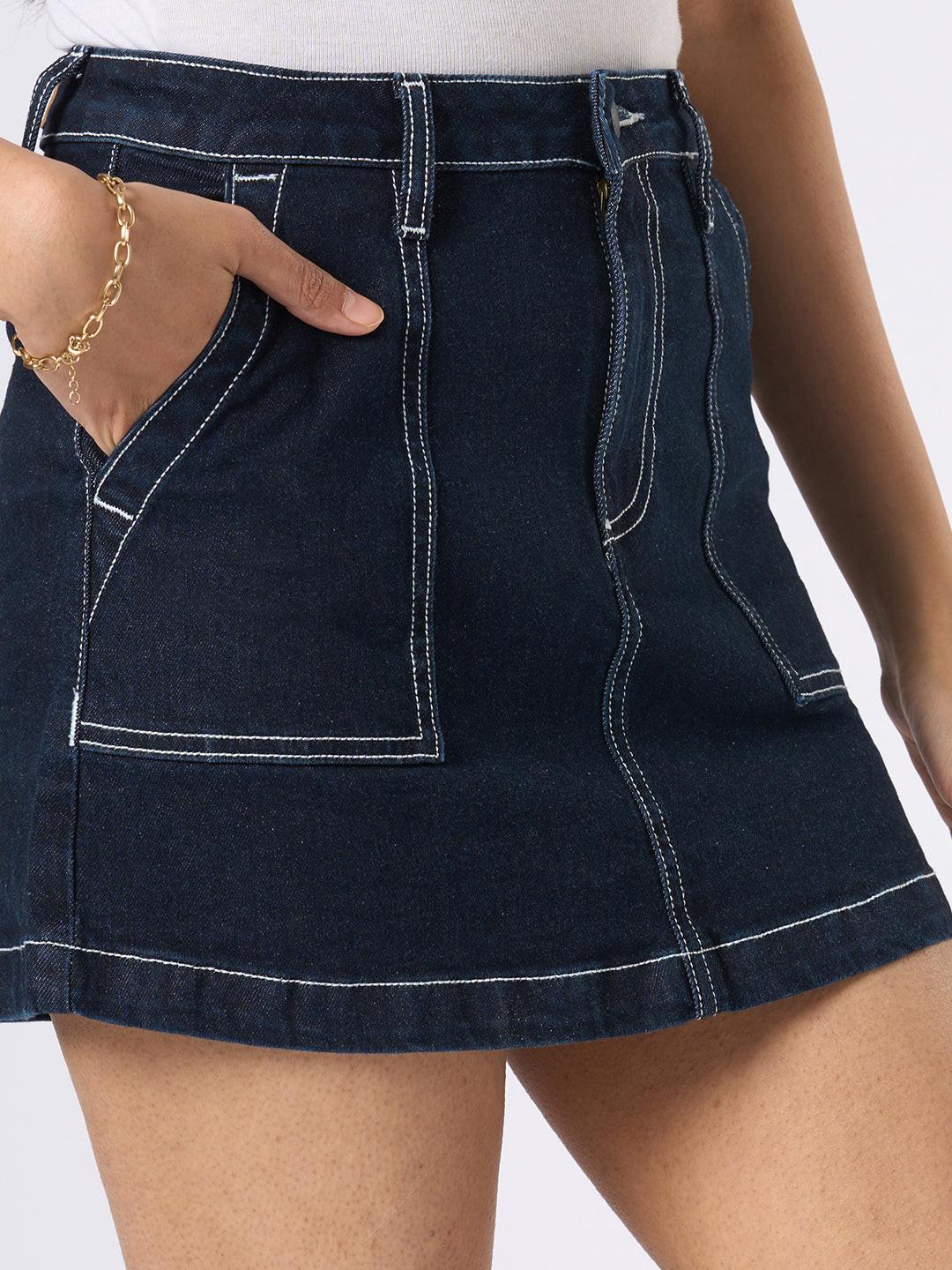 Person wearing a dark denim skirt by Rerasa