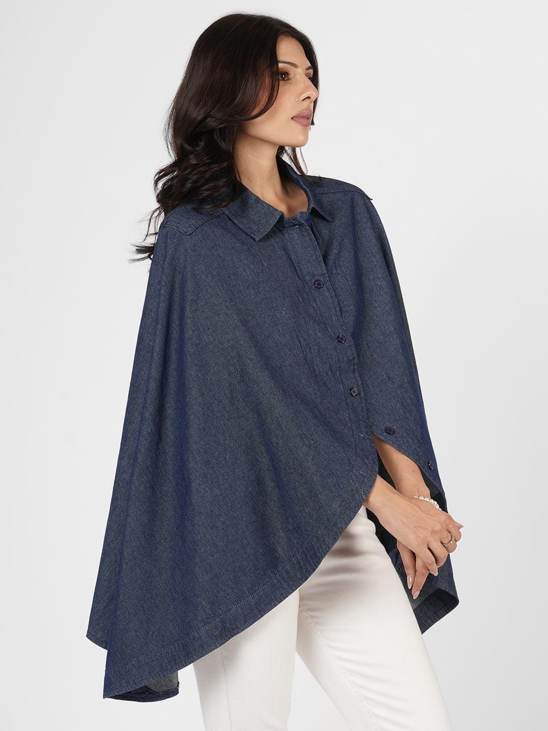Woman wearing a blue poncho over  by Rerasa
