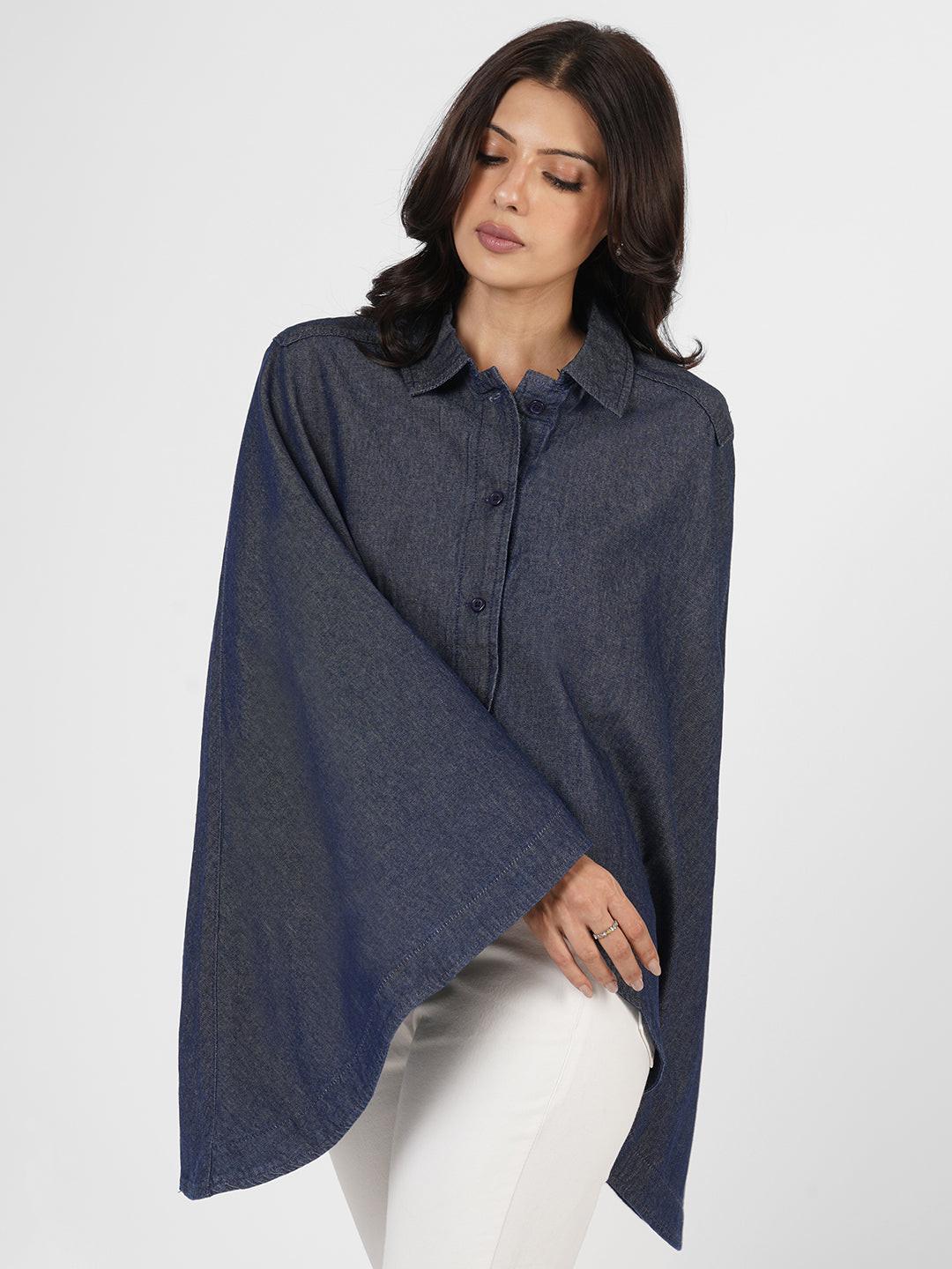 Woman wearing a blue poncho over  by Rerasa