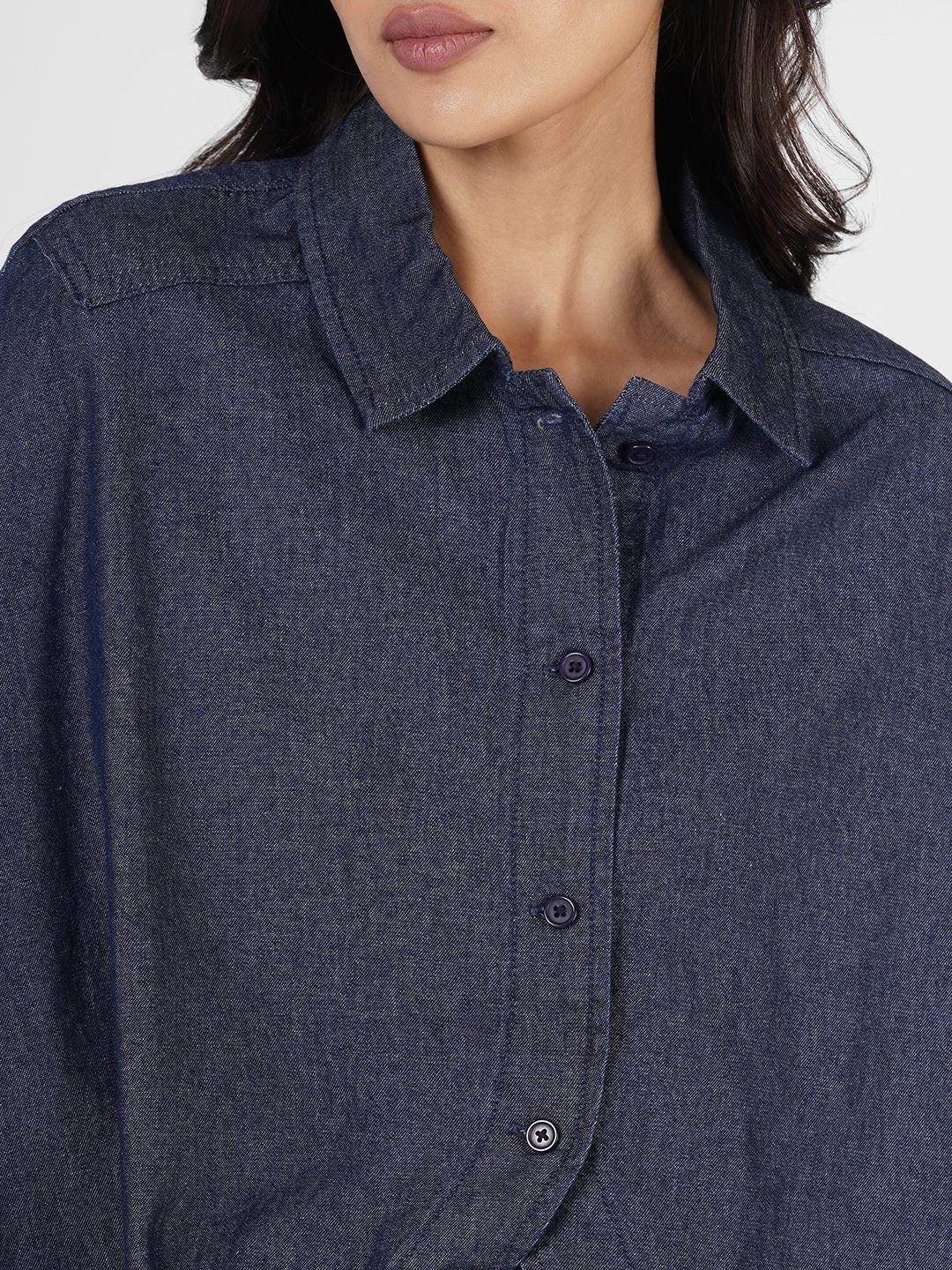 Woman wearing a blue poncho over  by Rerasa