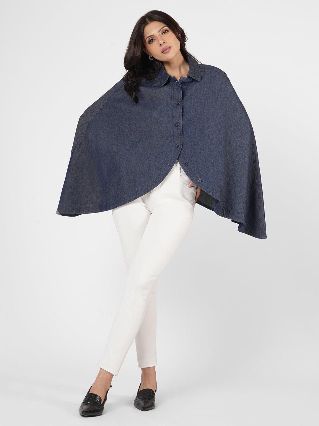Woman wearing a blue poncho over  by Rerasa