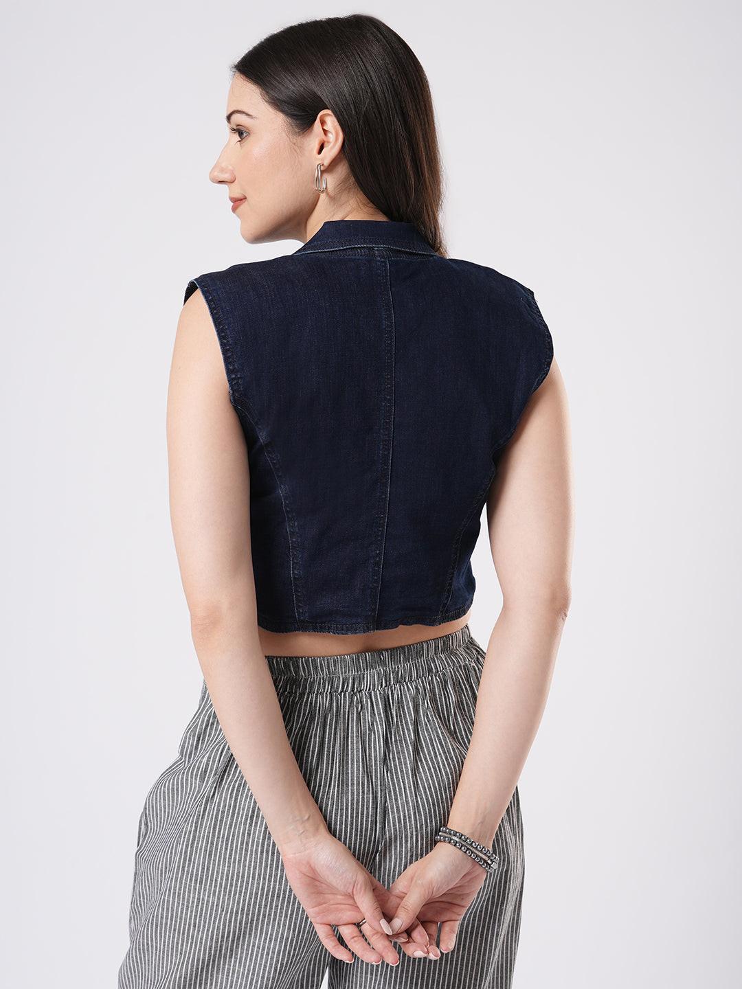 Woman wearing a denim vest by Reasa