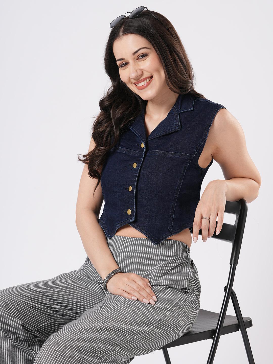 Woman wearing a denim vest by Reasa