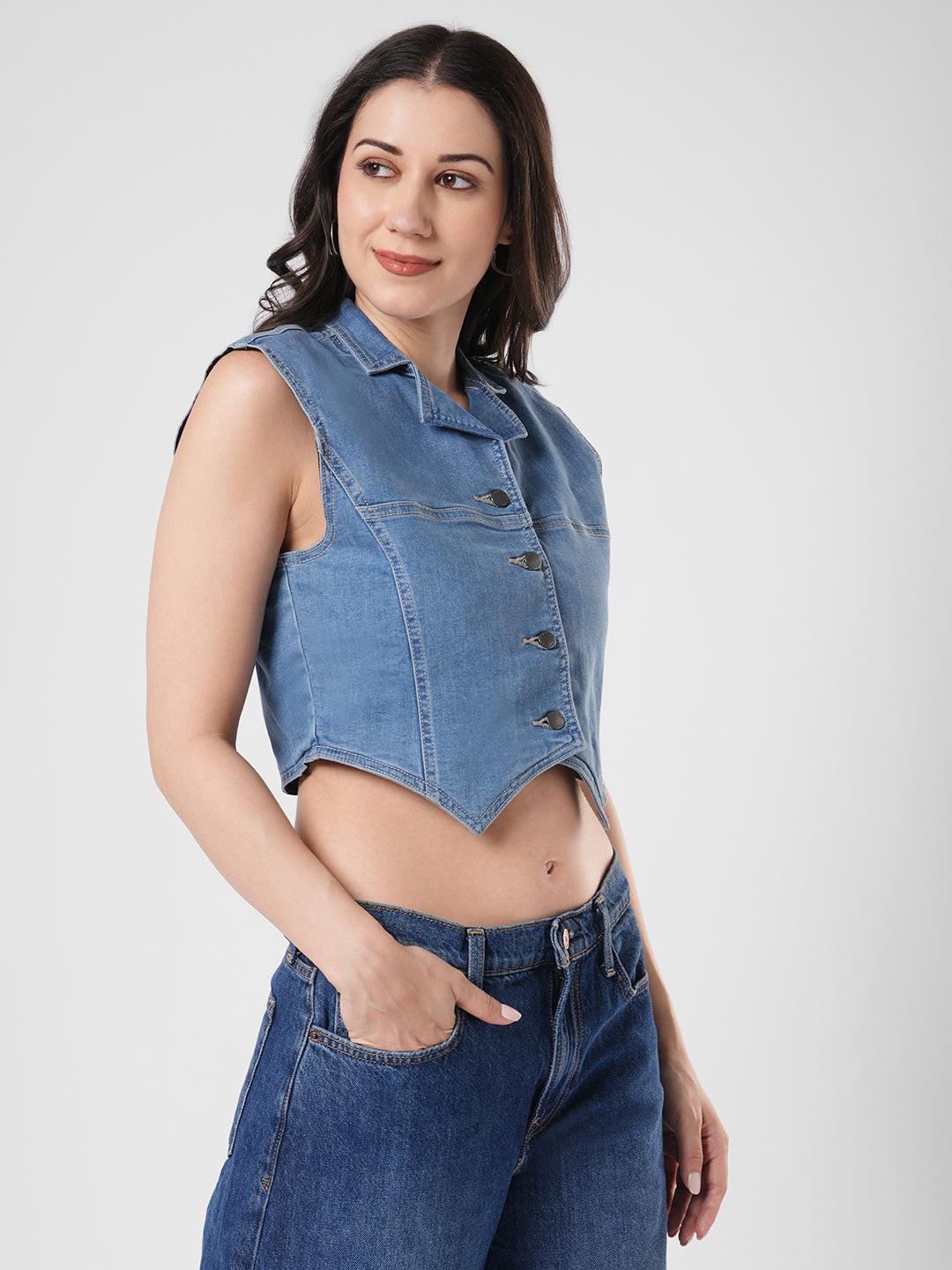 Woman wearing a denim vest by Reasa