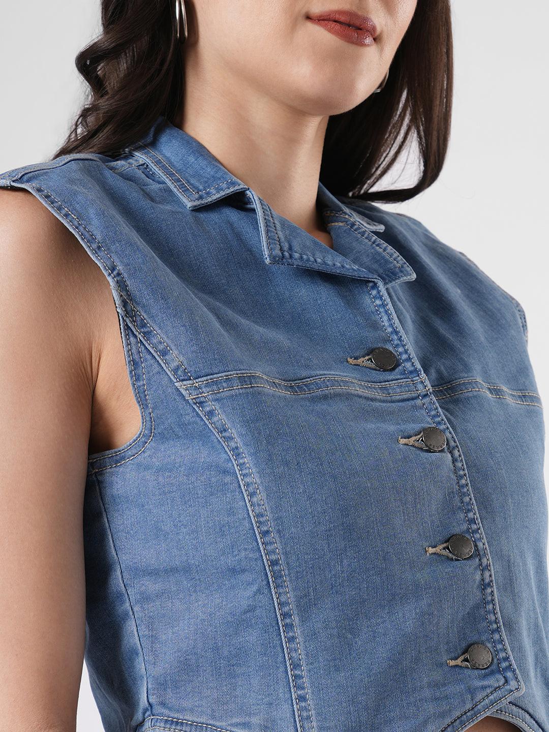 Woman wearing a denim vest by Reasa