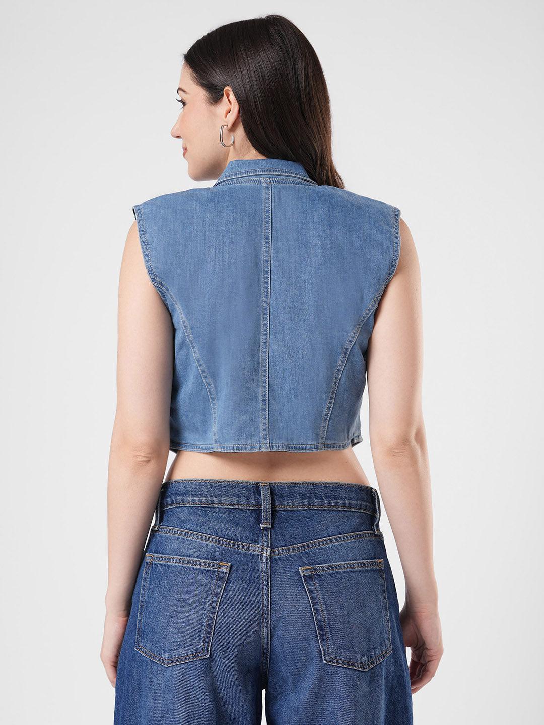 Woman wearing a denim vest by Reasa