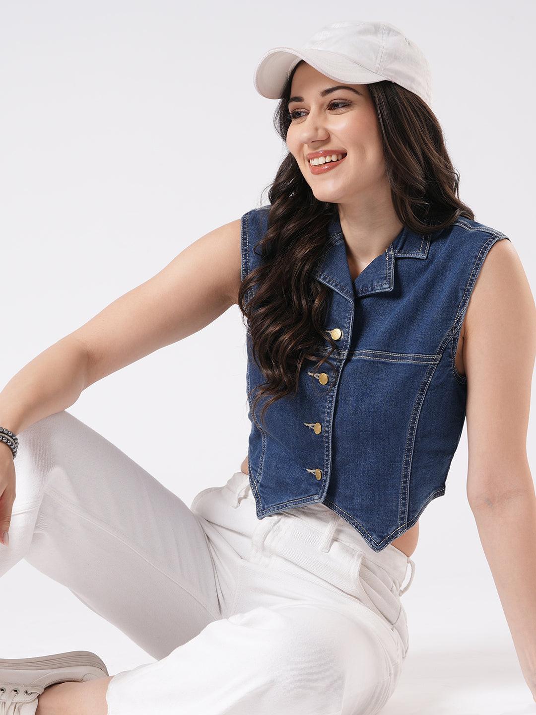 Woman wearing a denim vest by Reasa